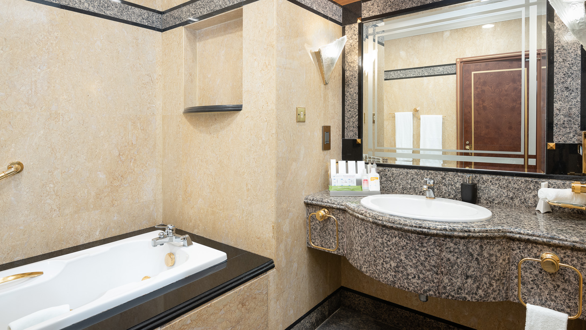 Ensuite bathroom with luxurious bath amenities