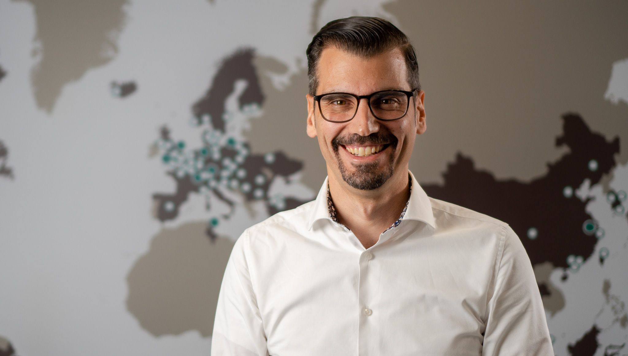 portrait of man smiling into camera