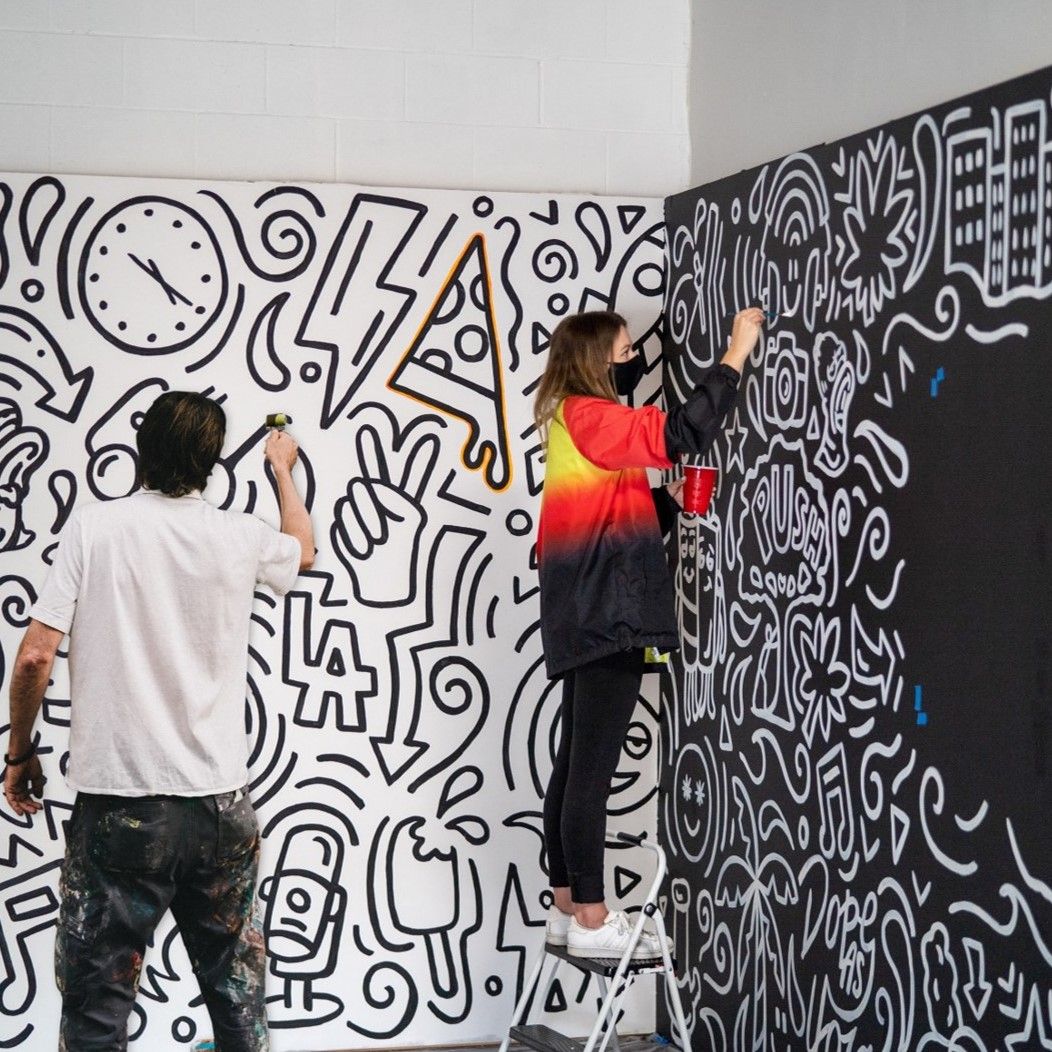 2 people painting a wall – inspire people