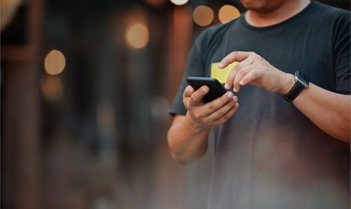 Mobile phone in hand 1053479878