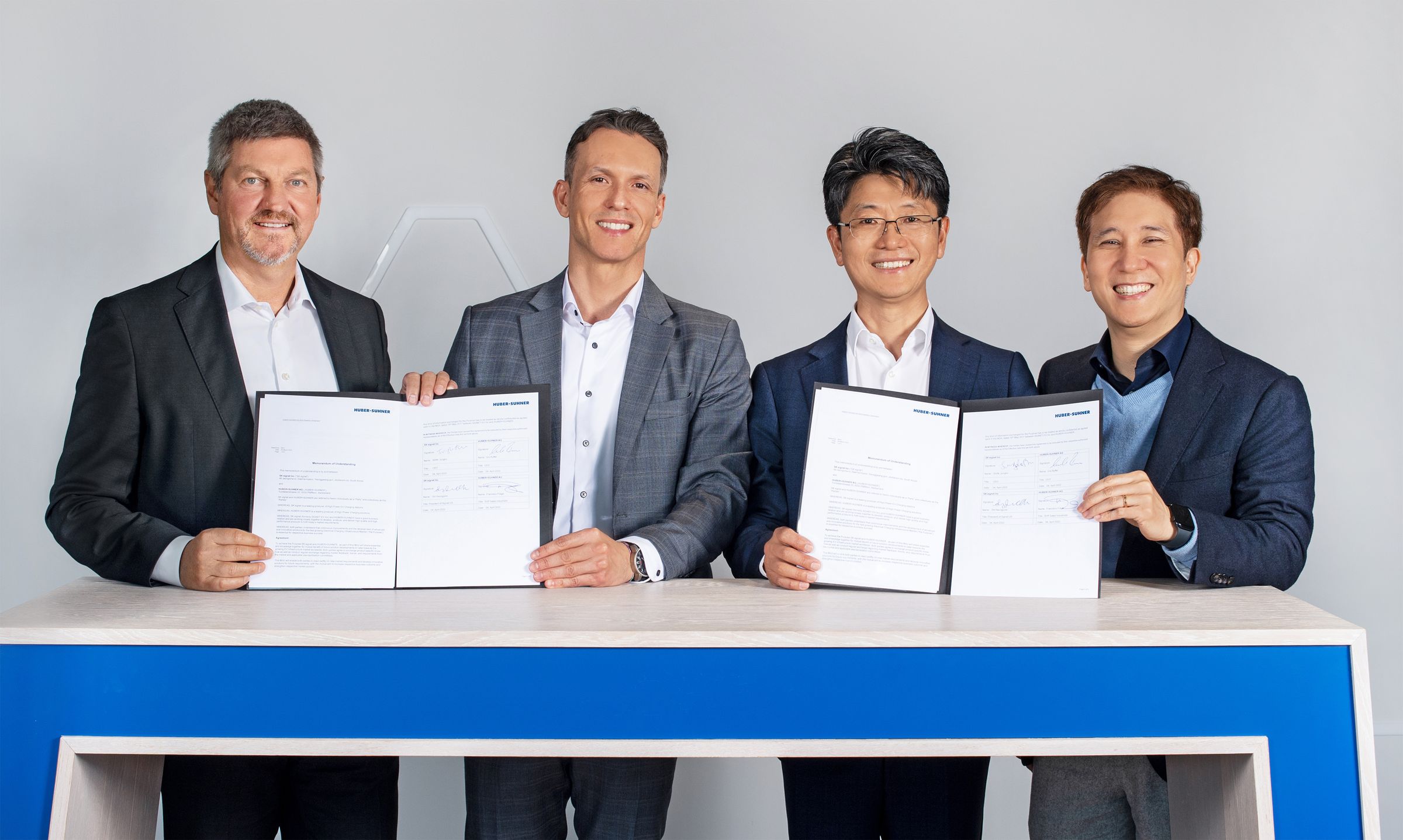 HUBER+SUHNER AG and SK Signet Inc