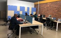 5 people working in an office in Malaysia