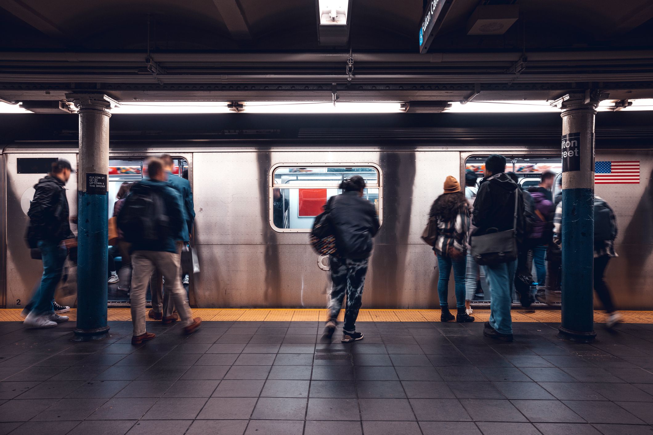 subway station with people waiting for train 1436058144