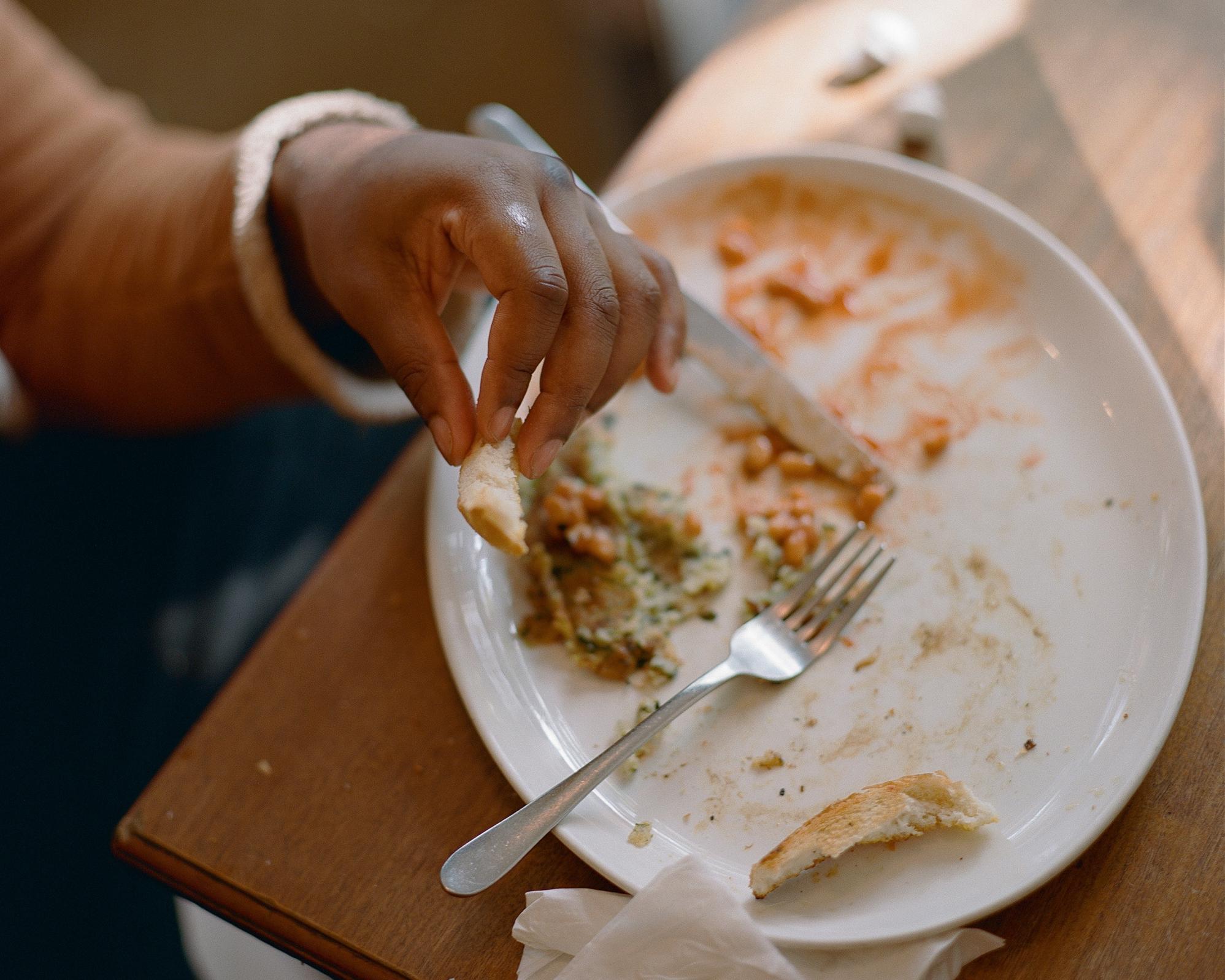 Leftovers from breakfast on a plate.