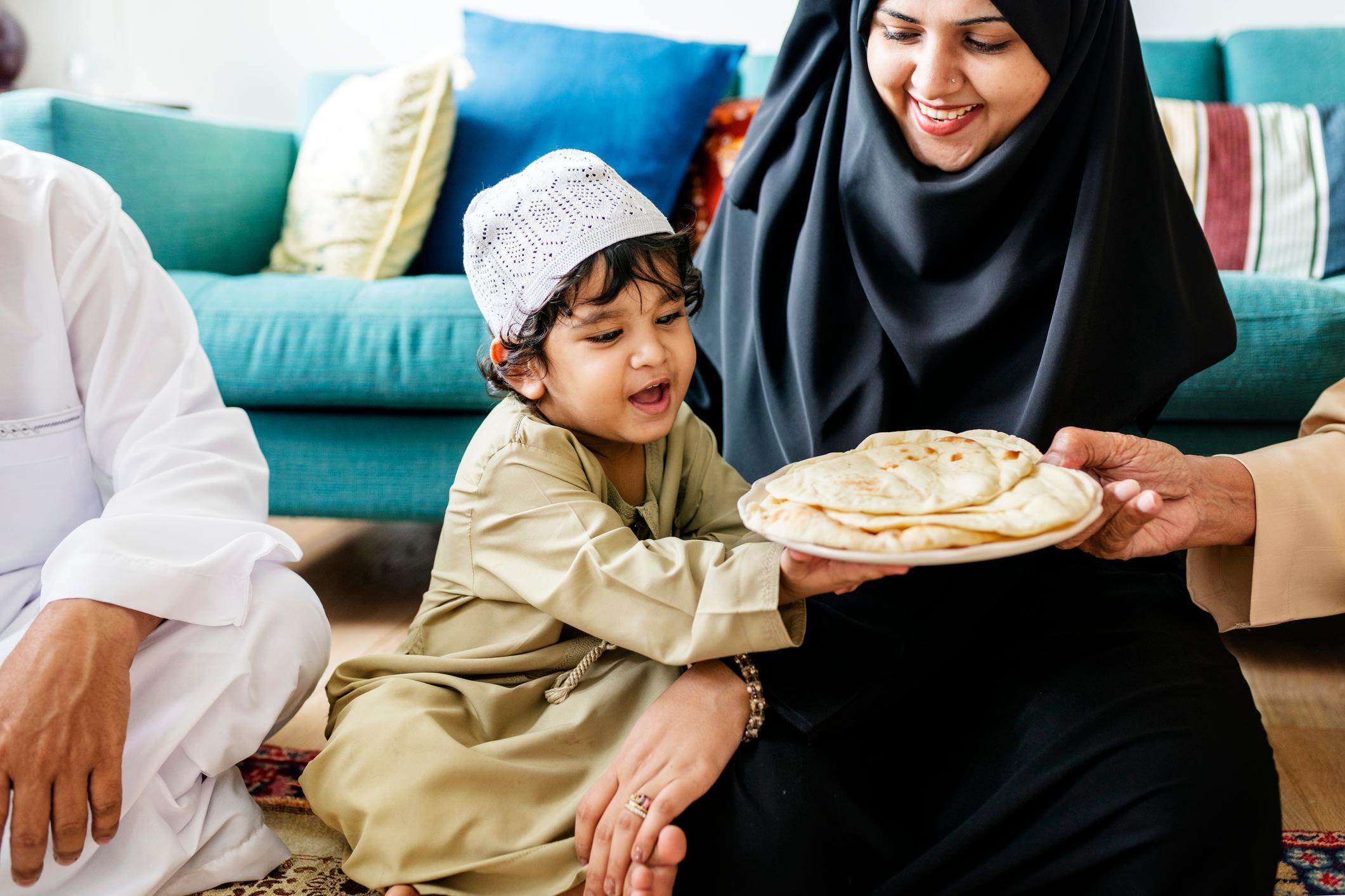 Muslim family having dinner on the floor