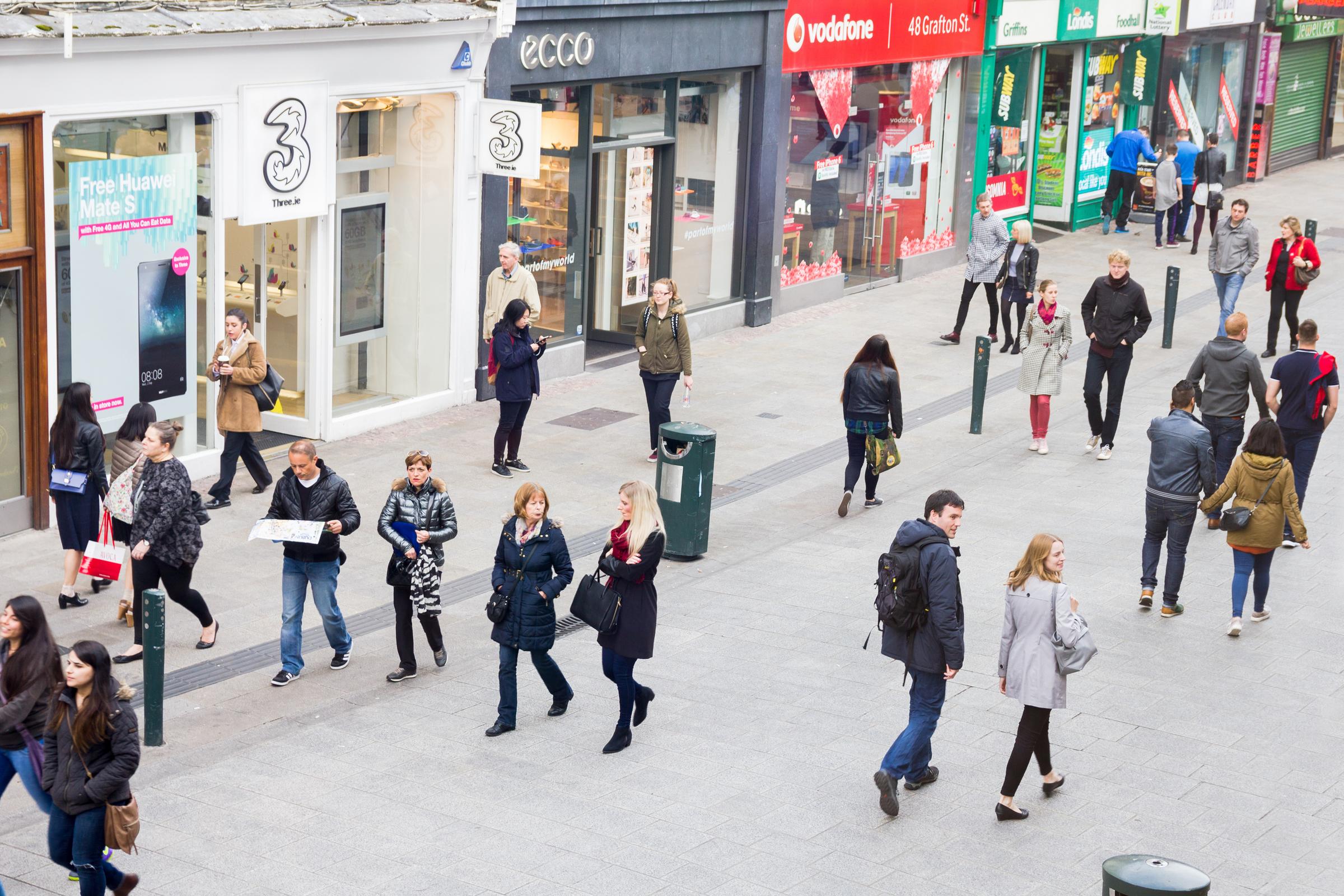 People walking on a busy street.