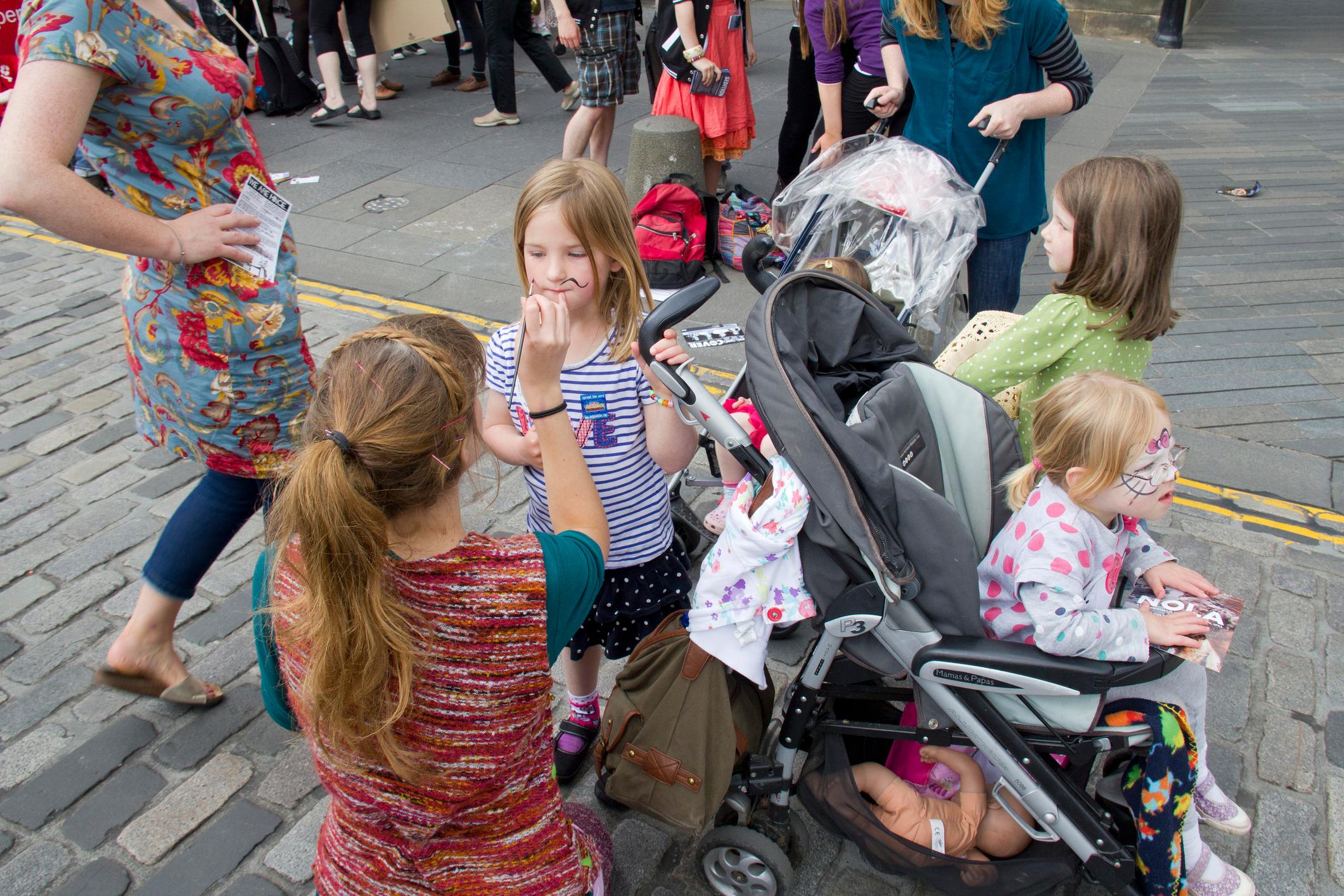 Lady painting childrens faces.