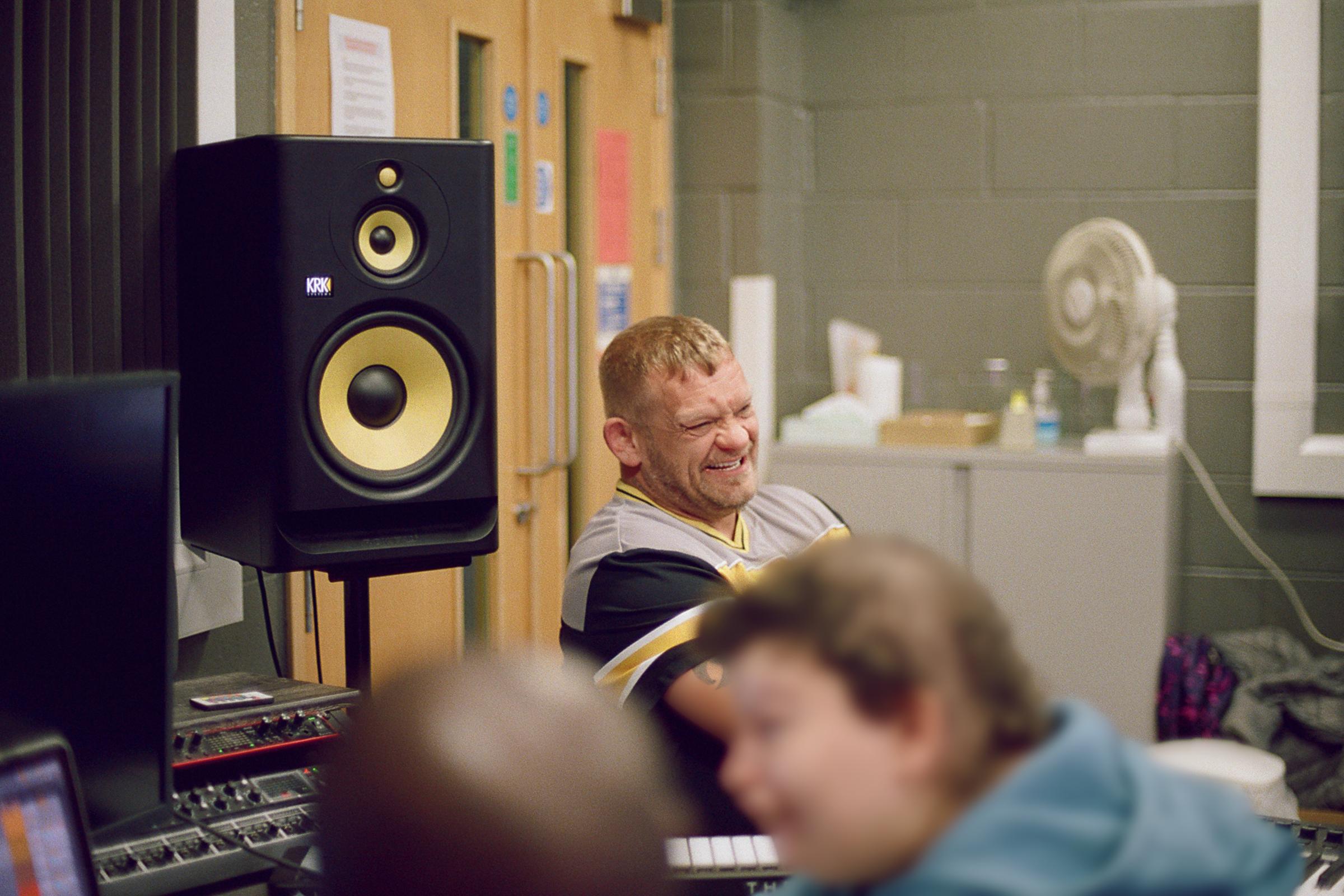 Volunteers making music in music studio