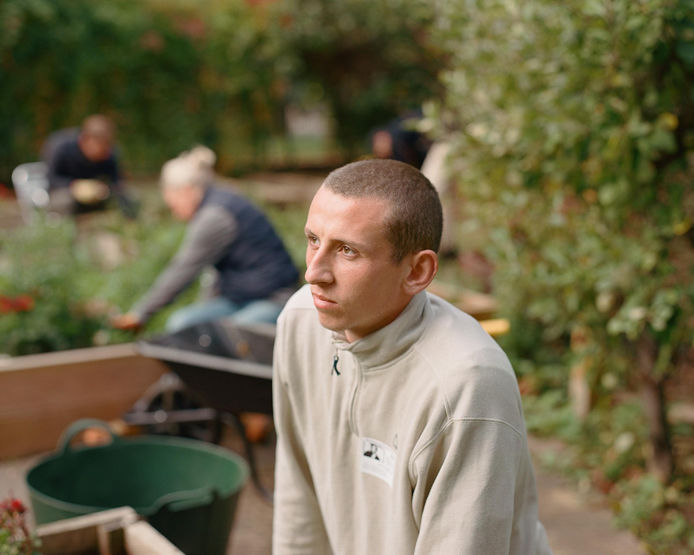 Volunteers tidying a school garden. 