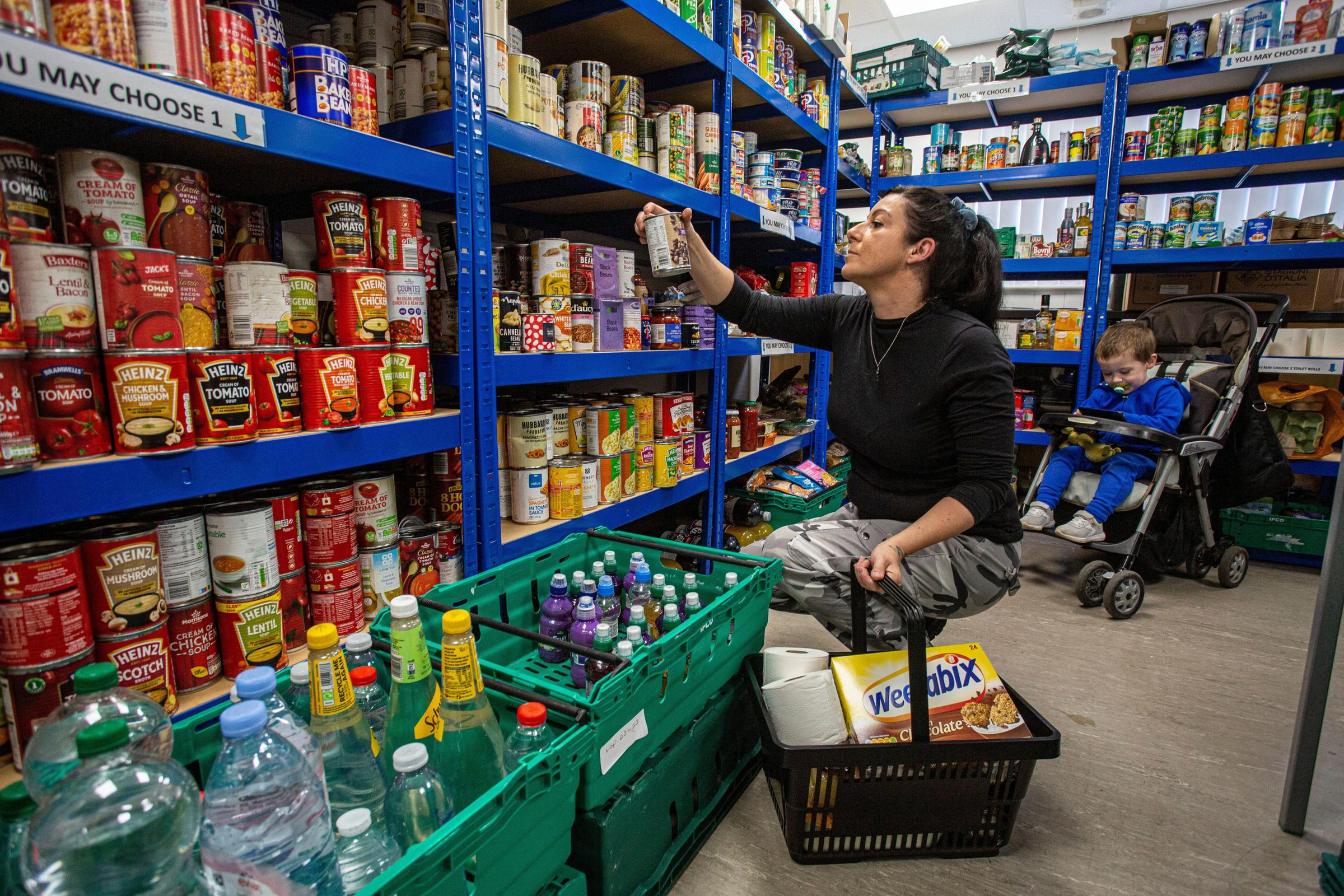 Mother and her son using a food bank.