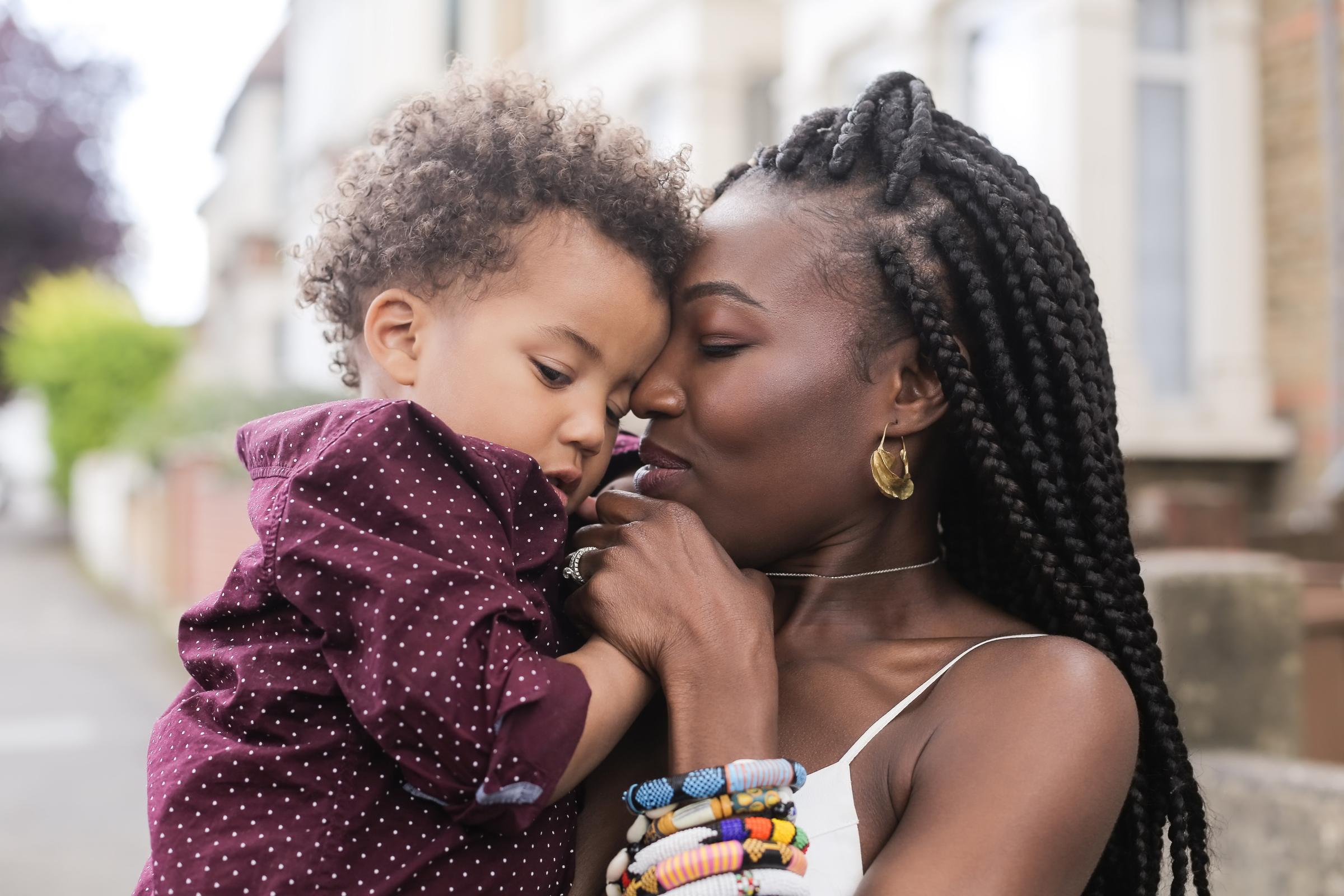 Mother holding her son in her arms.