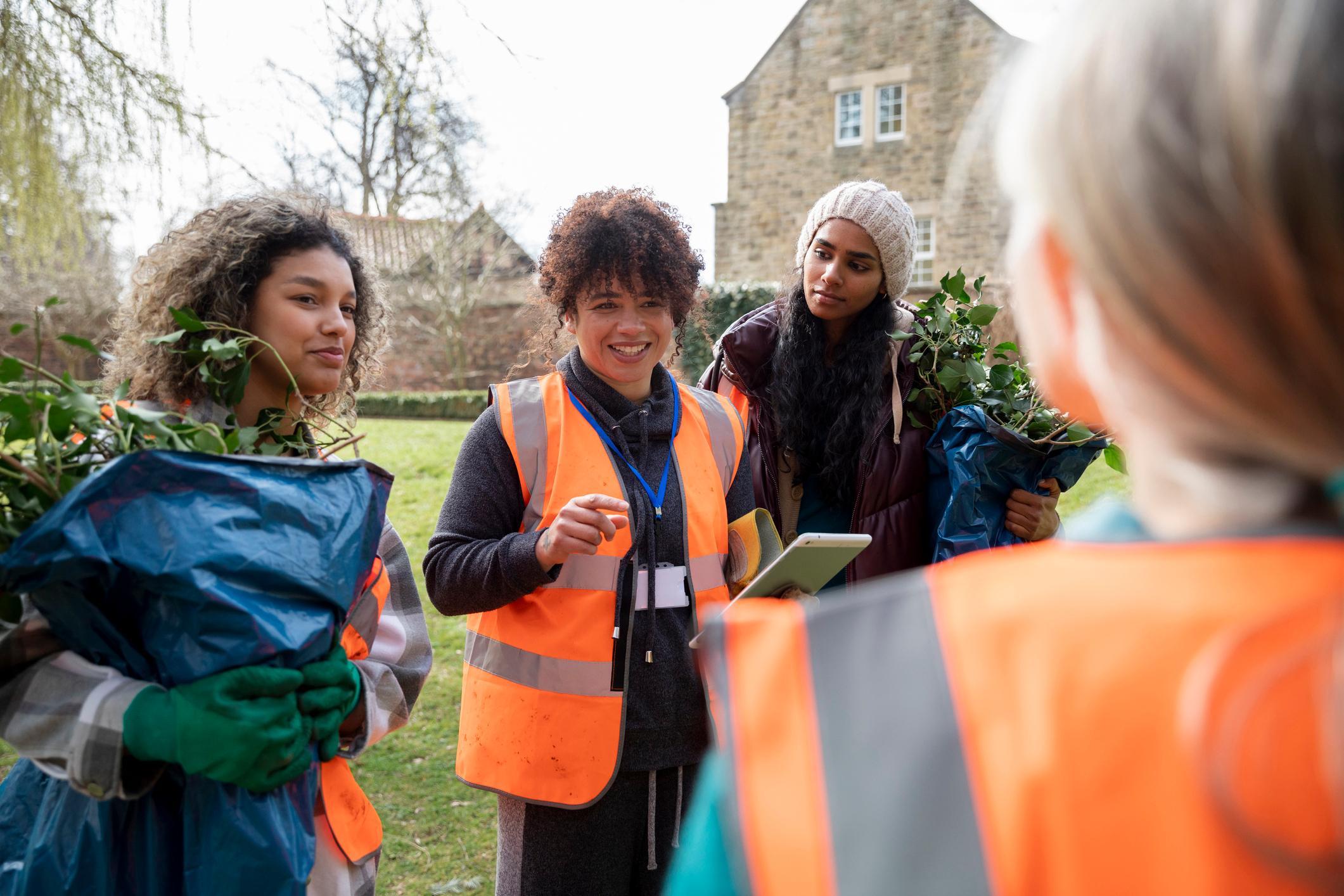 Young women working on a community garden.