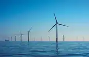 Offshore wind farm under blue sky