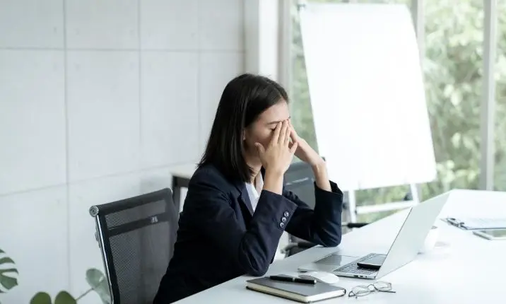 stressed woman with headache