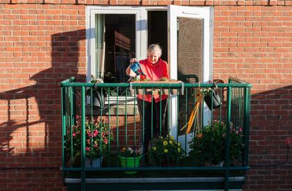 Resident watering plants at Bedford Court, Leeds