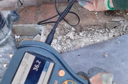 Measuring damp levels within a cavity wall of a home 