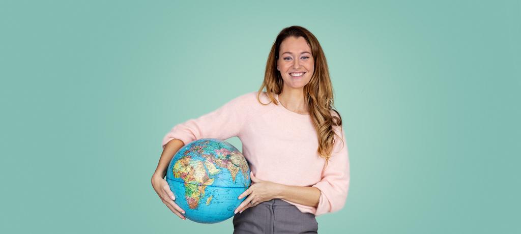 Woman with globe, business - hero