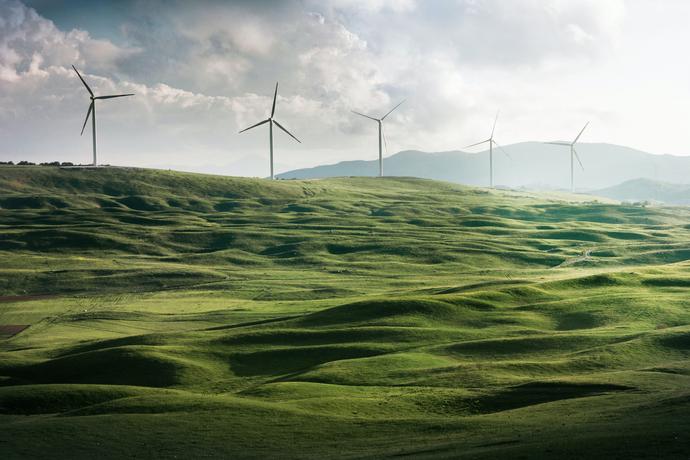 Green hillside with wind turbines
