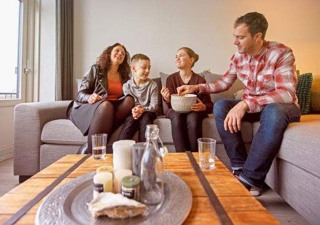 Family sitting on couch