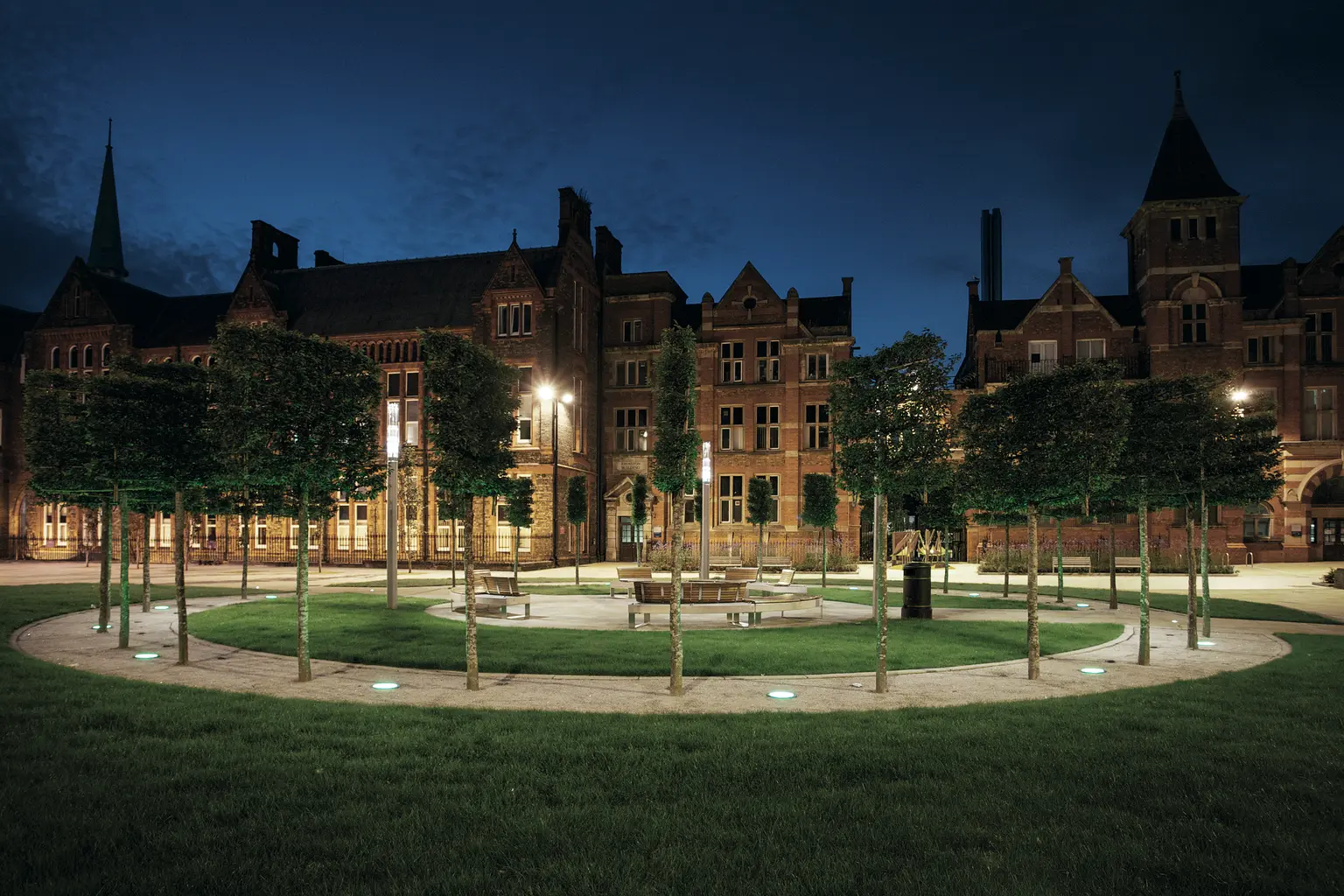 Liverpool University outdoor area for students to congregate being illuminated subtly using in-ground luminaires