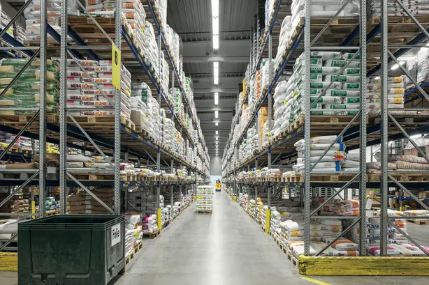 A large warehouse illuminated with industrial lighting by Zumtobel. 