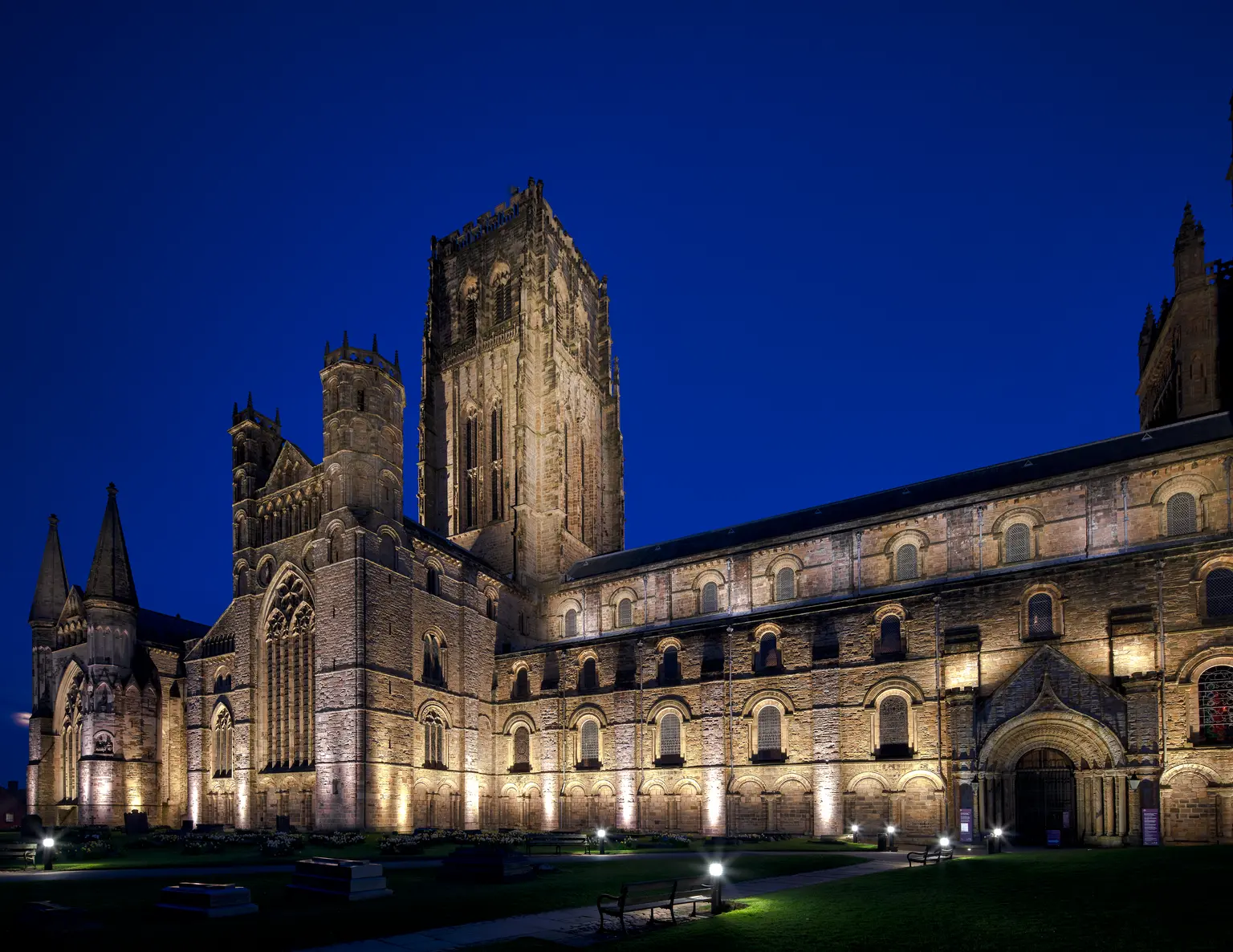 Durham cathedral being illuminated at night with architectural floodlights