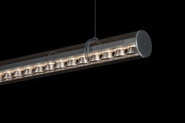 The concert hall in Lucerne illuminated with colourful Zumtobel lights. In the foreground are the chairs for the orchestra.