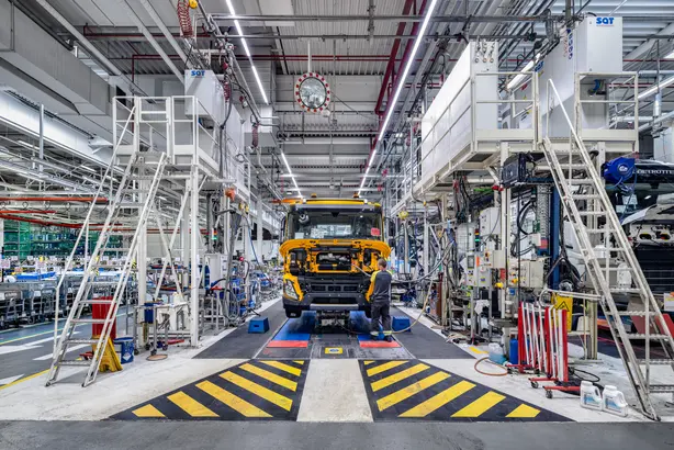 The Volvo factory in Ghent with a truck on the production line. Illuminated by Zumtobel luminaires.