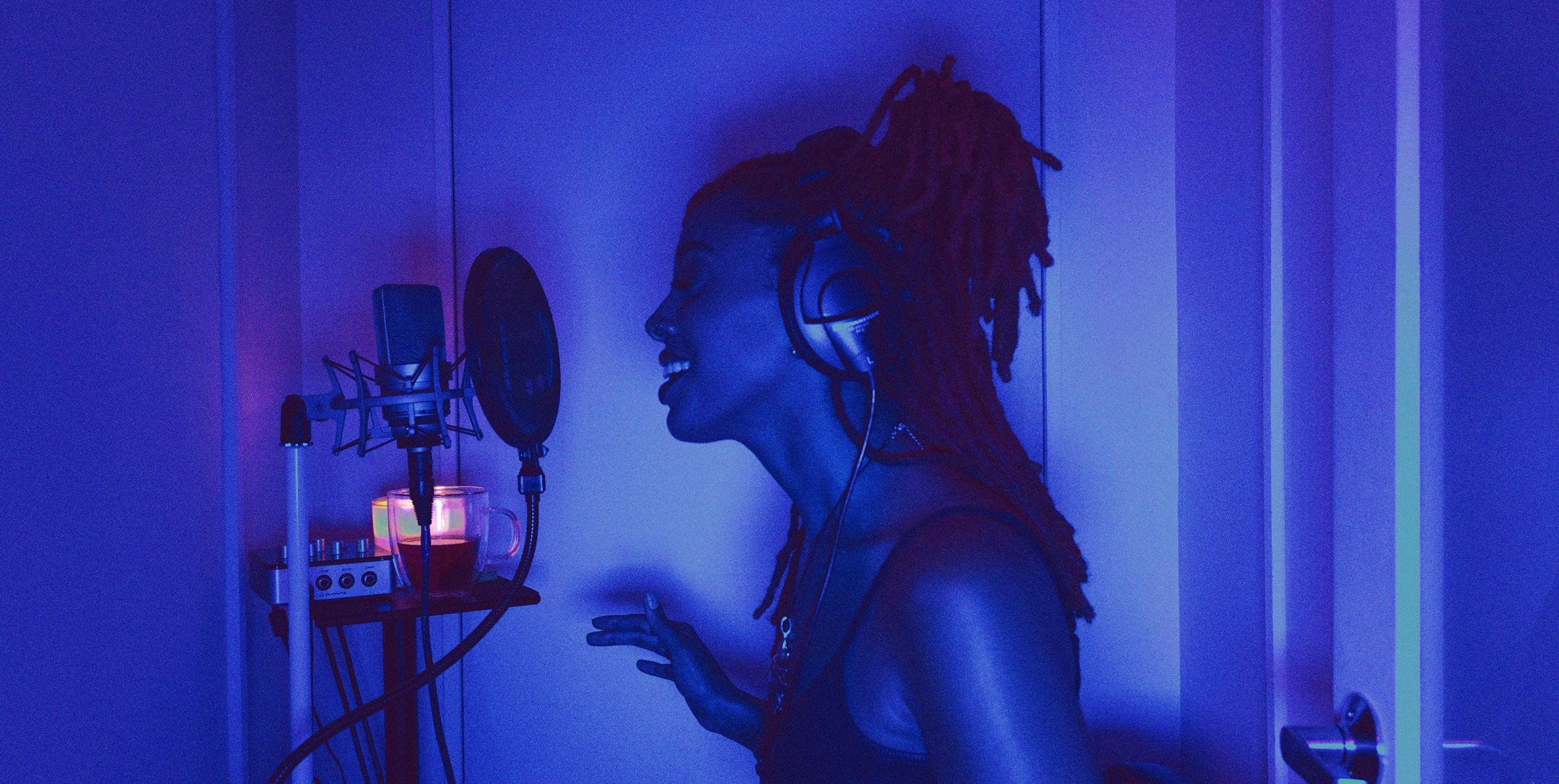 Adyen team members working at their office with dual computer monitors displaying digital content.