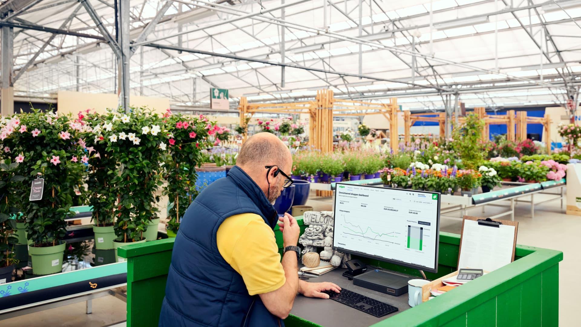 Man looking at laptop doing financial reconciliation