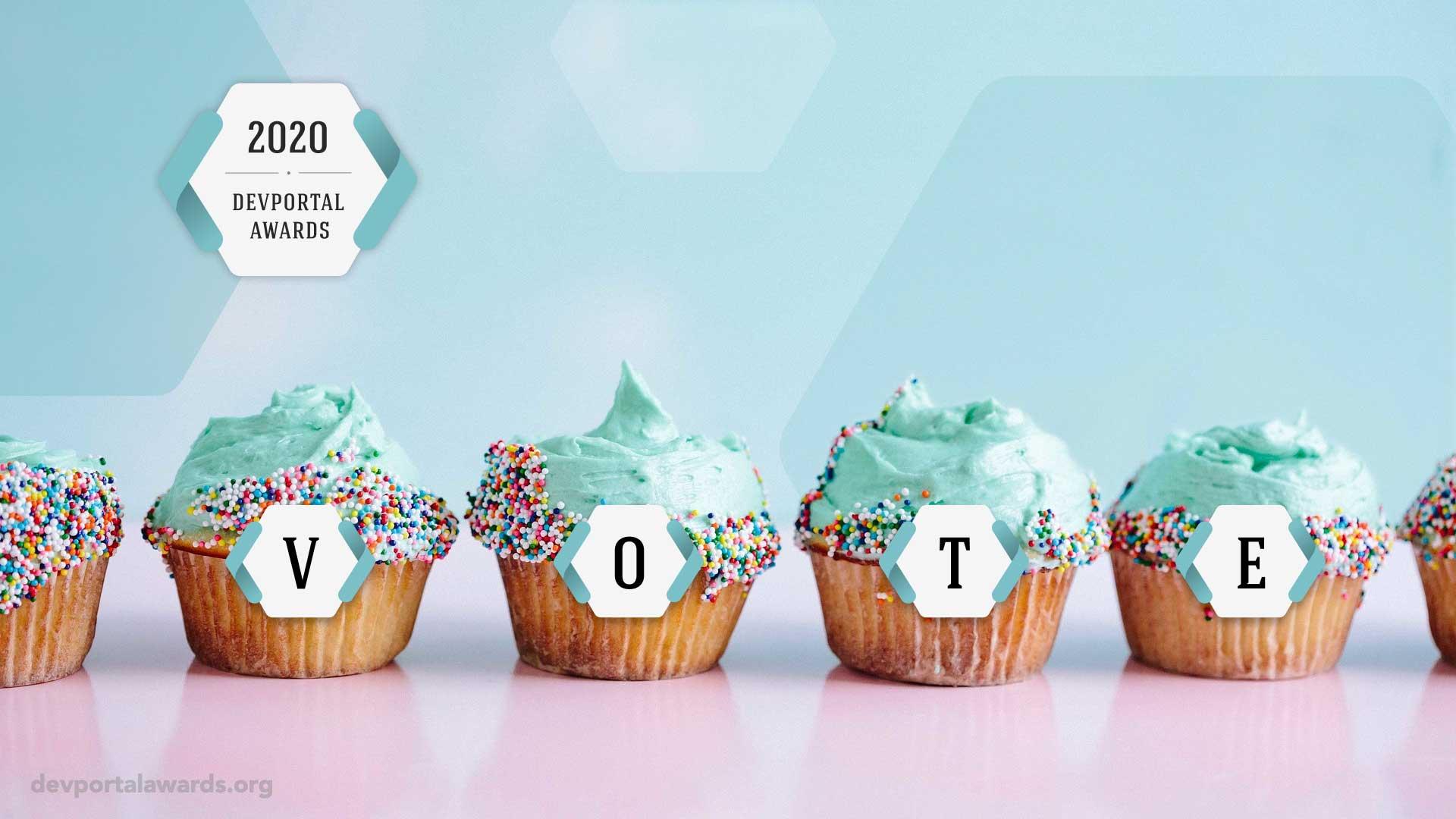 Cupcakes with colorful sprinkles arranged to spell VOTE.