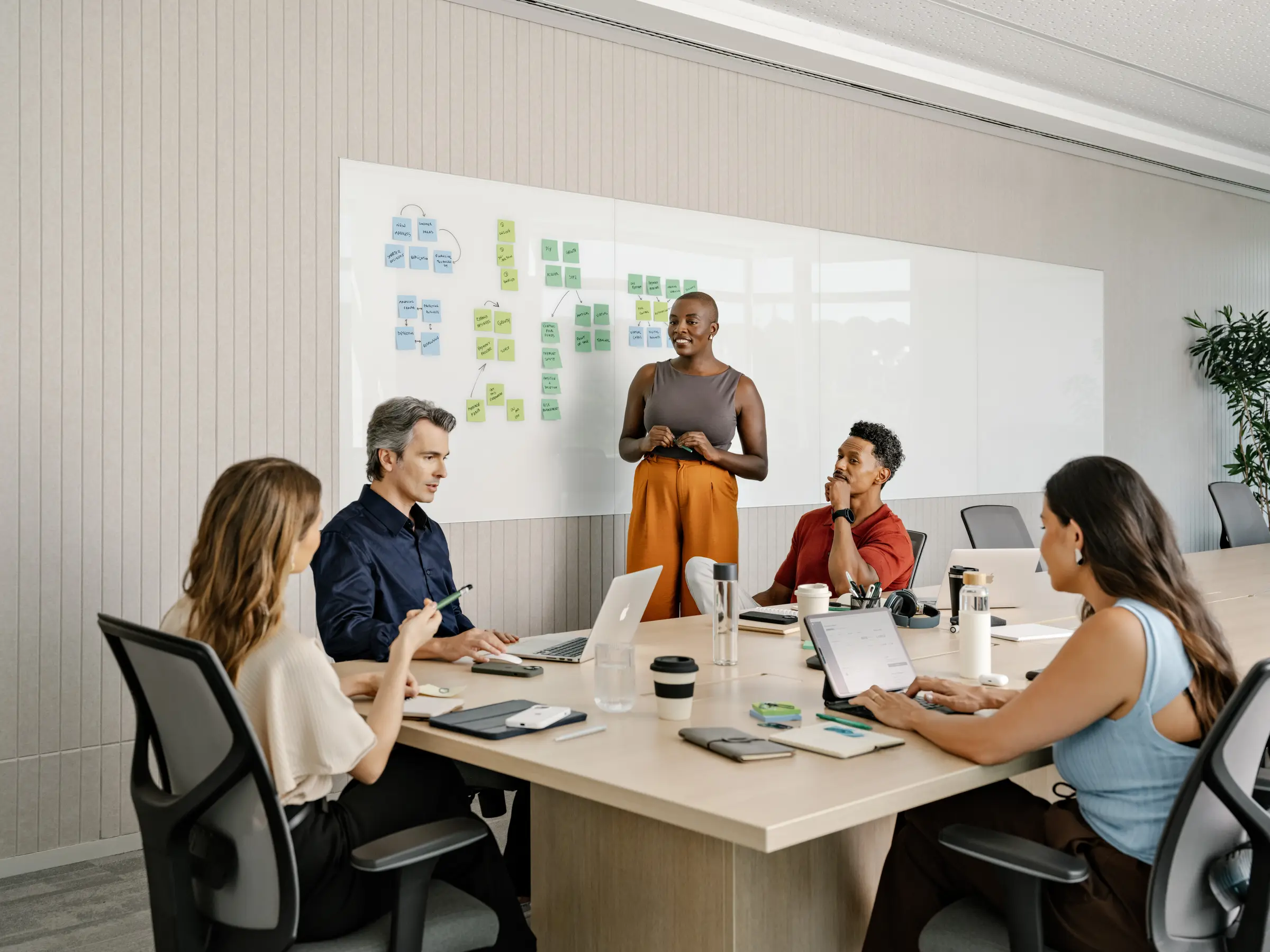 Group in a meeting room discussing a topic