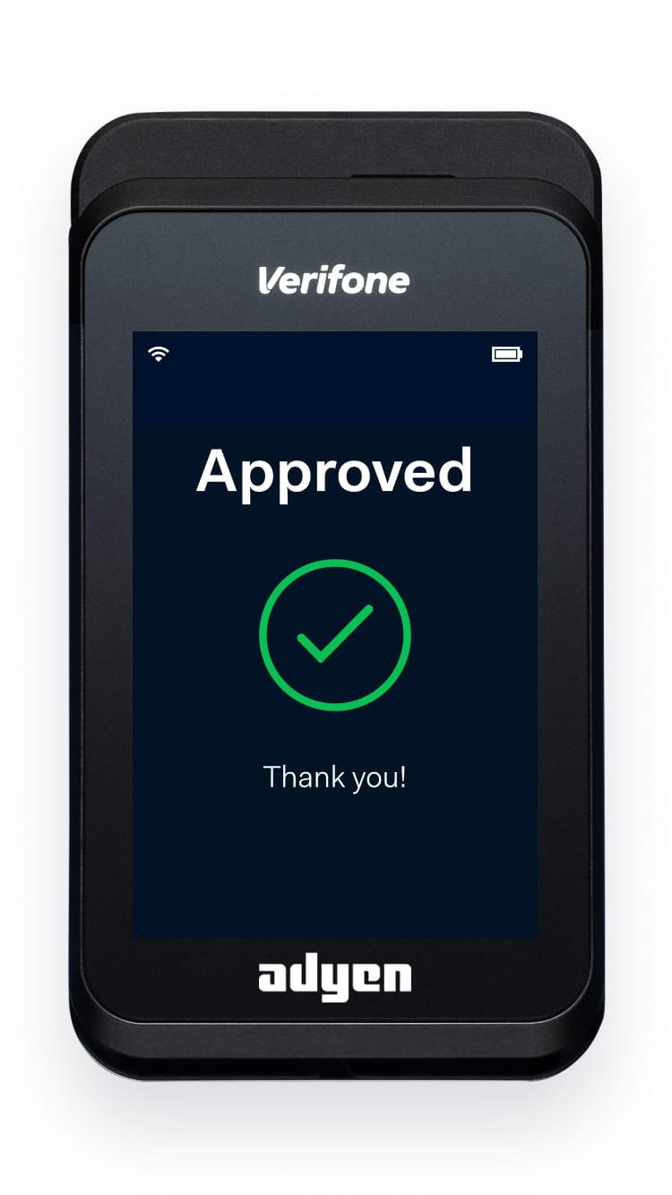 Adyen payment terminal displaying an 'Approved' message with a green checkmark.