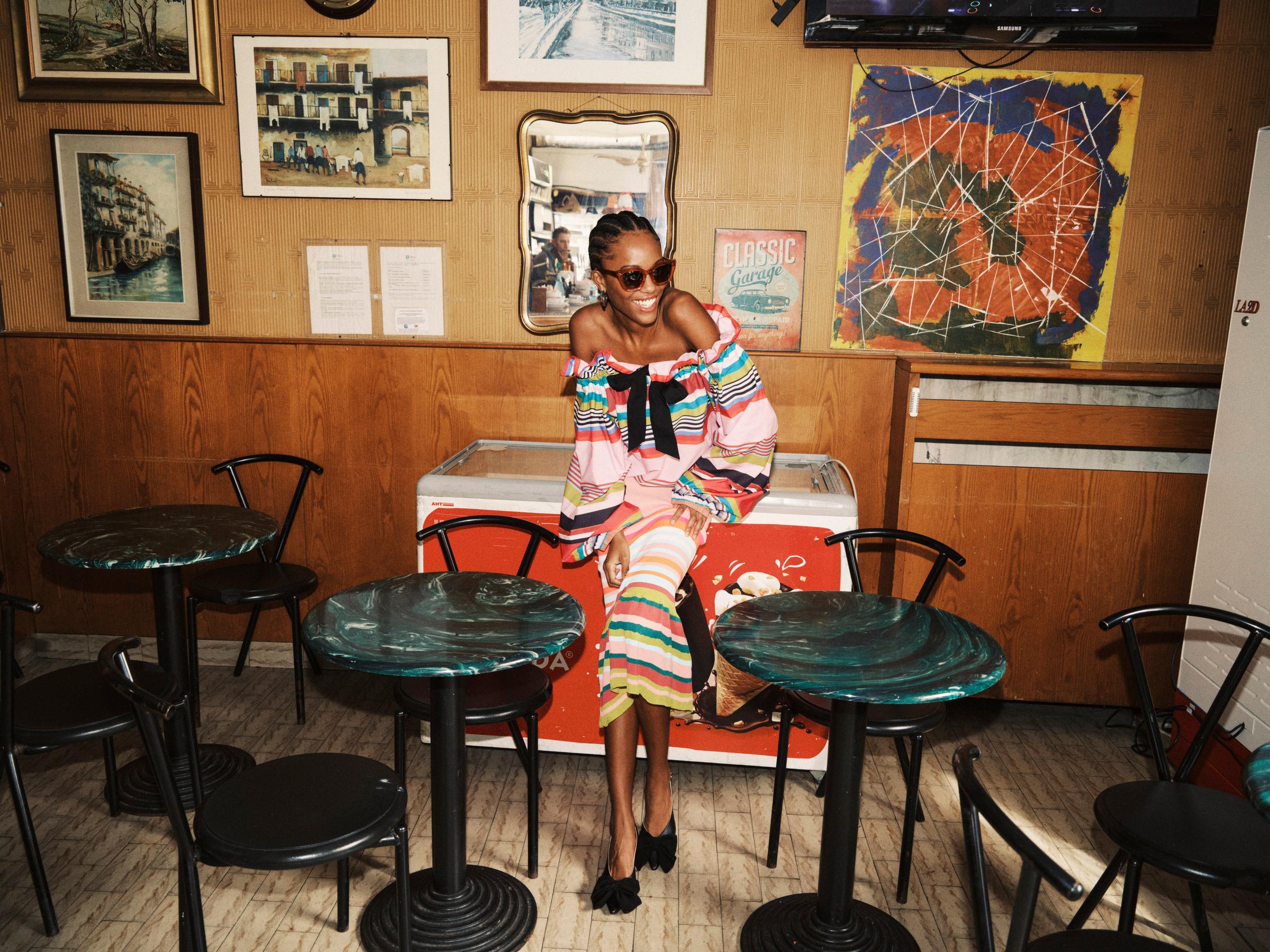 Model wearing Essentiel Antwerp in a cafe