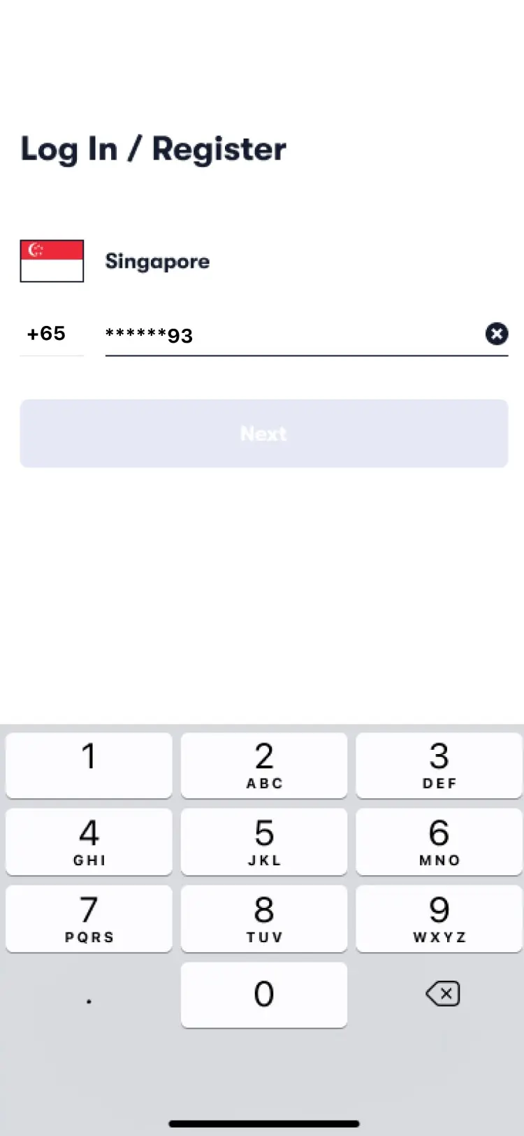 Mobile phone number login or registration screen with numeric keypad.