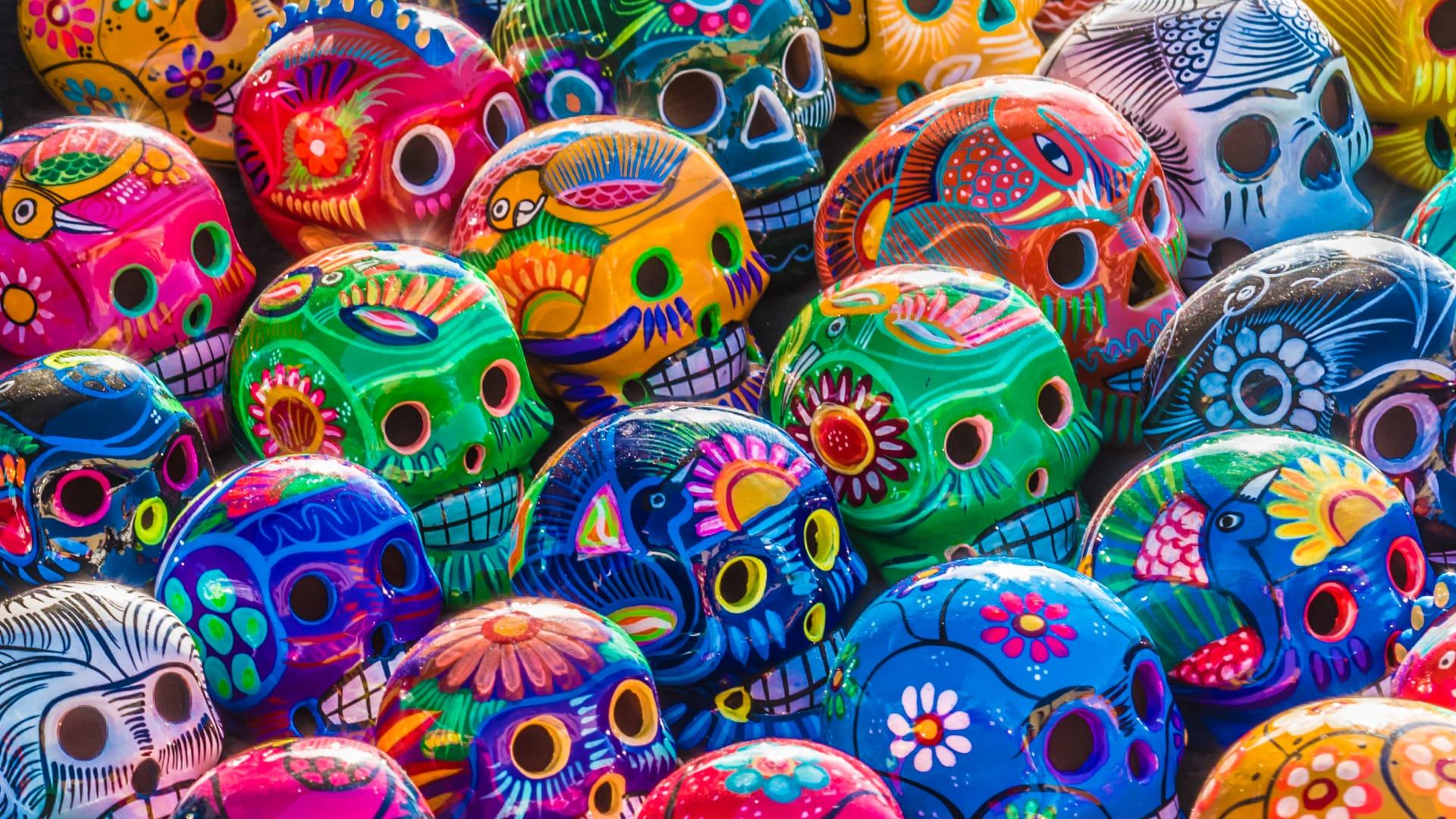 Colorful decorative skull figures for Day of the Dead celebration.