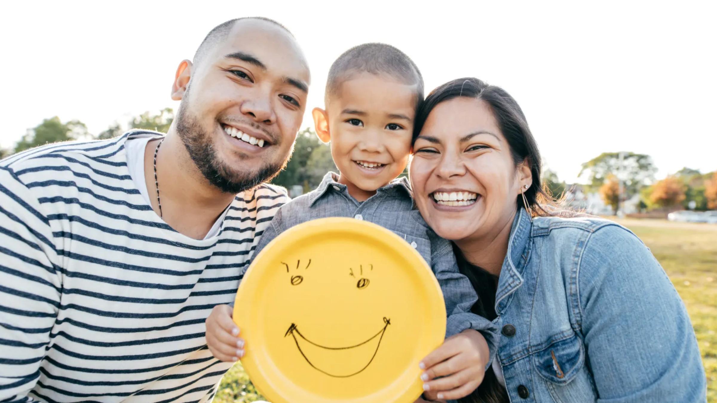 A family smiling with GoFundMe logo