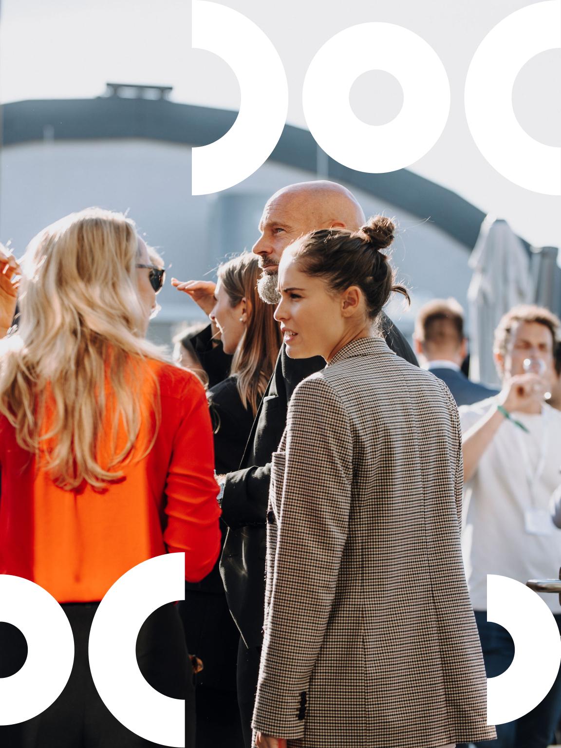 People on a rooftop chatting to eachother