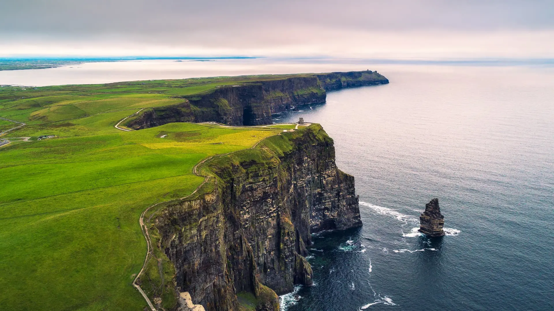 Aerial view of the Cliffs of Moher on a cloudy day in Ireland.