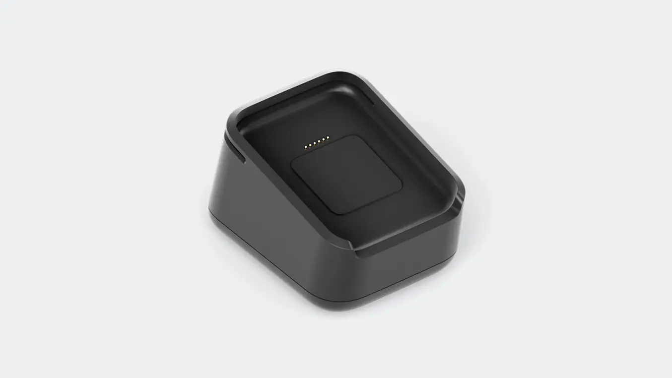 Wireless payment terminal with embedded charging dock, branded with Adyen logo.