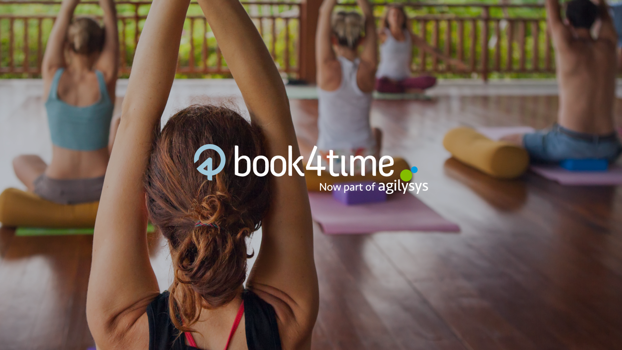 People doing yoga with a Book4Time logo layered on top