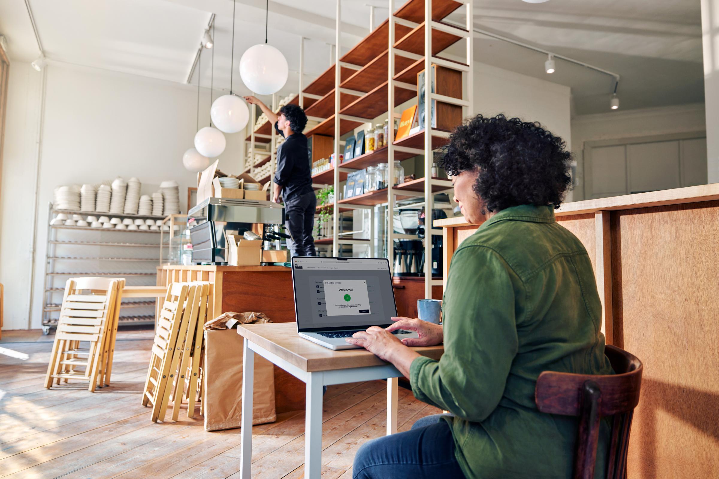 Coffee shop owner setting up Adyen payments through a SaaS platform for food & beverage