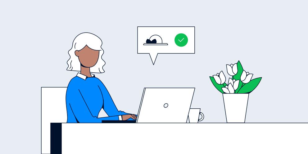 Cartoon of a person at a desk with a laptop showing a cloud checkmark icon, indicating successful data upload.