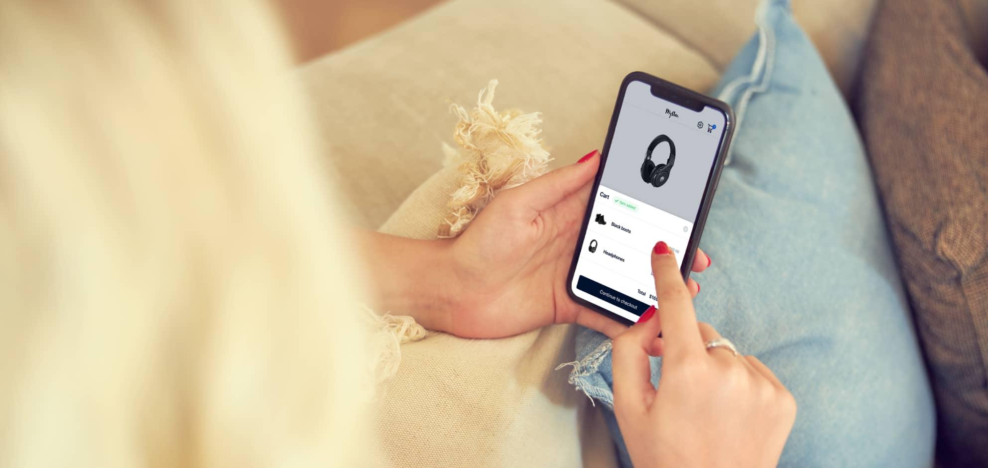 A women shopping on her phone in her home