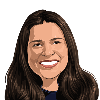 Adyen team member smiling, showcasing a welcoming and professional demeanor.