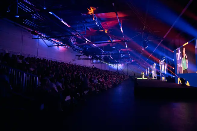 Groups of people in an audience during sales event of Adyen