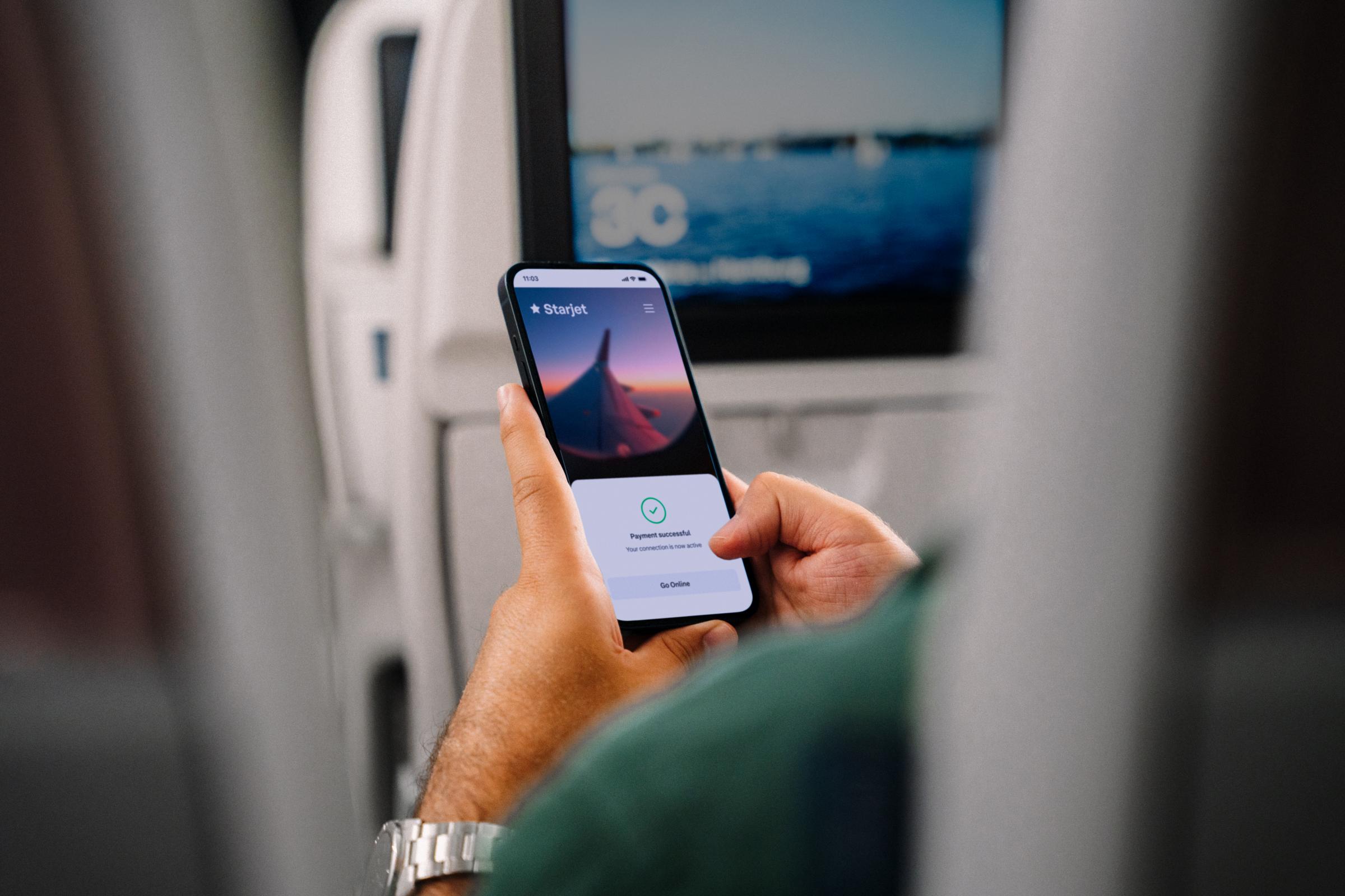 Customer making a payment using an Adyen terminal on a mobile device.