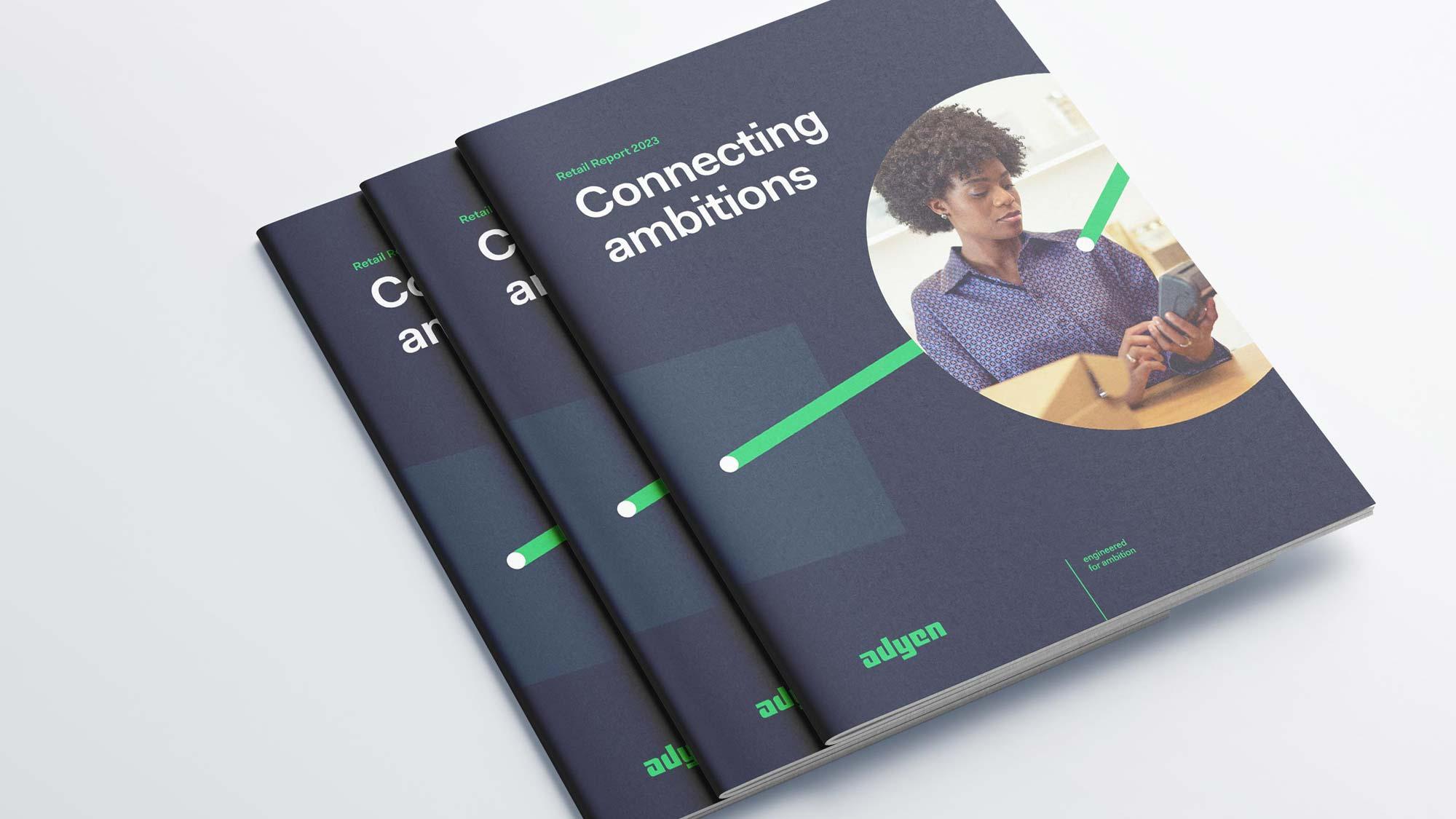 Drie Adyen detailhandelsrapporten met de titel 'Connecting ambitions' op de cover met een persoon die een telefoon gebruikt.