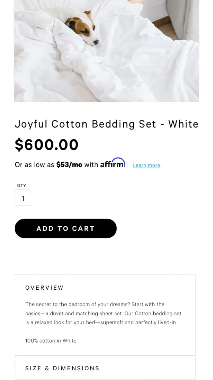 Small dog resting in a white cotton bedding set displayed on a web page with product details and price.
