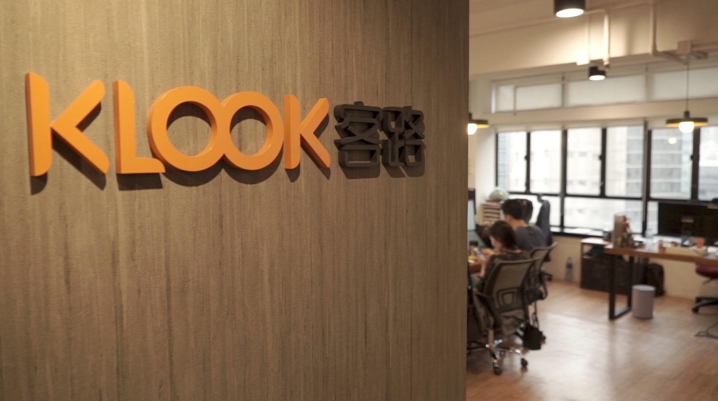 Interior of an office with 'KLOOK' logo on the wall.